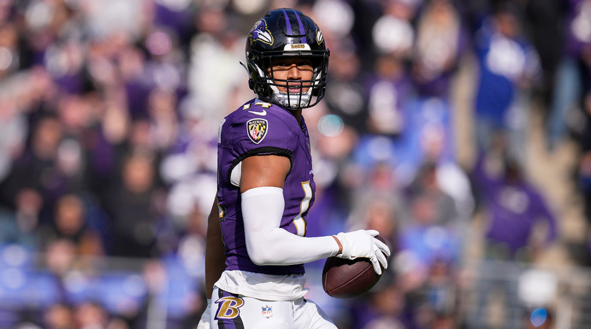 Kyle Hamilton holds the ball after scoring a touchdown for the Ravens